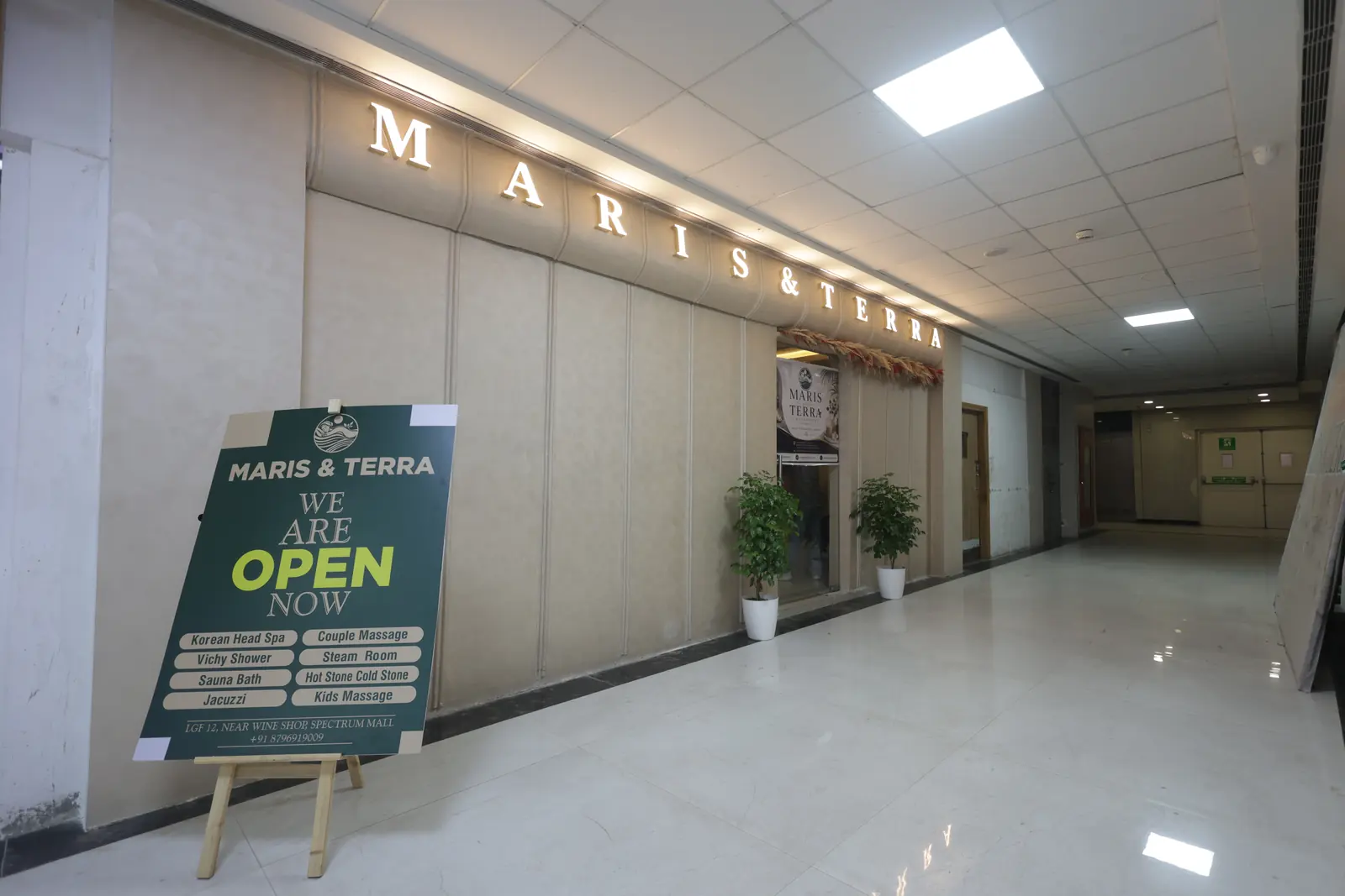 Maris & Terra welcome board listing spa rituals outside the Sector 75 Noida entrance